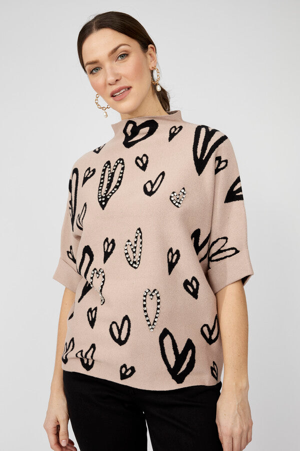 Pull orné bijoux à col montant