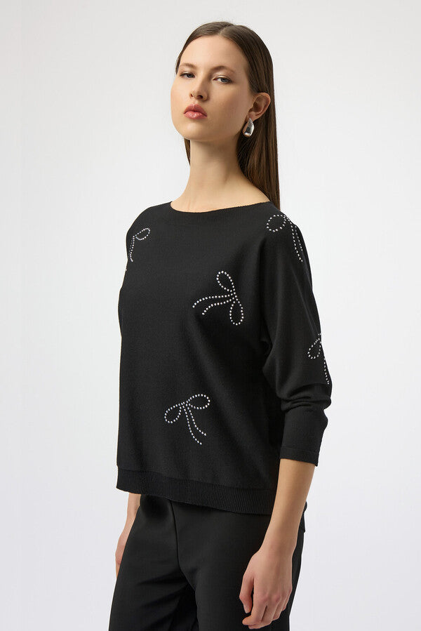 Pull à ornements bijoux